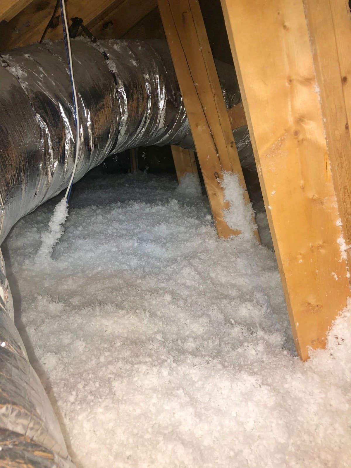 A completed EZ Attic Insulation project with fresh blown-in insulation in a Houston-area attic